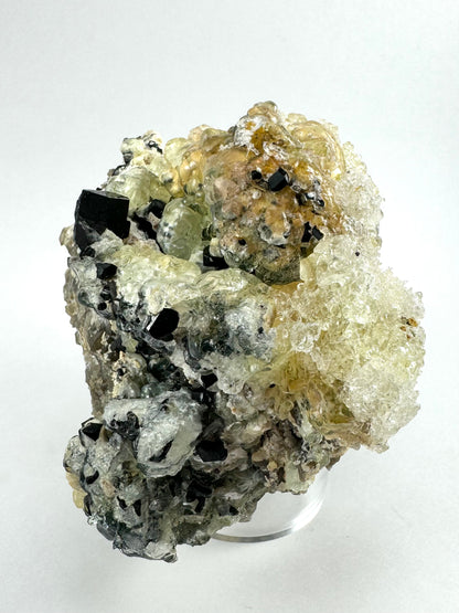 Black tourmaline in albite matrix with hyalite and minor fluorite