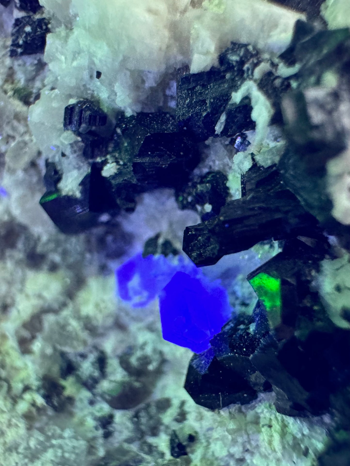 Black tourmaline in albite matrix with hyalite and minor fluorite
