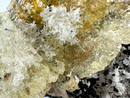 Black tourmaline in albite matrix with hyalite and minor fluorite