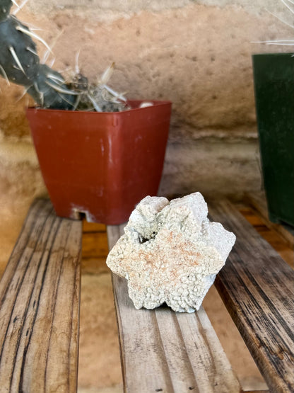 The piece on a shelf, a more distant view of it stood on edge.  The texture looks crackled from a distance