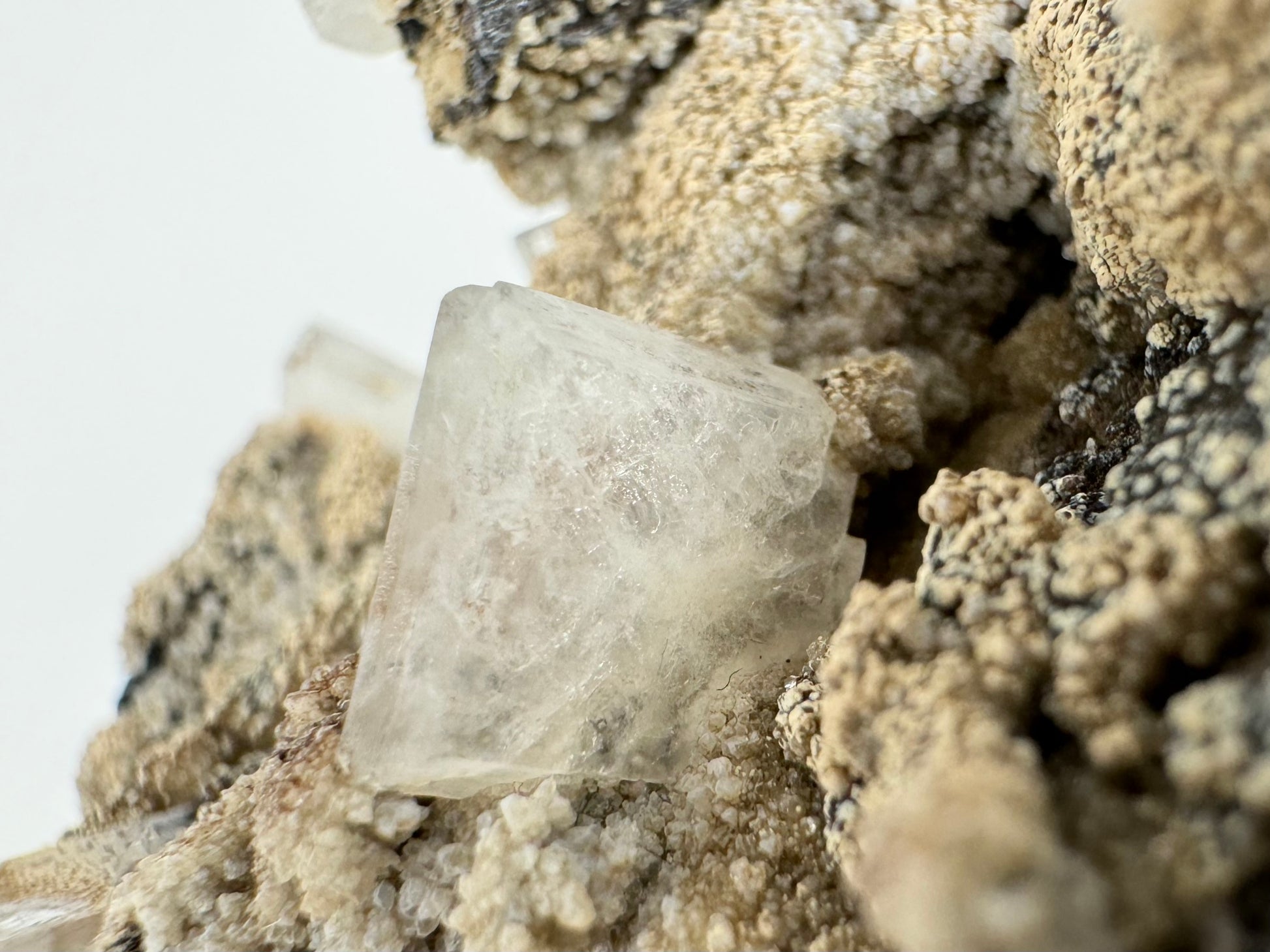 Detail of a clean white hydroxyapophyllite crystal on the surface without any mineral overgrowth