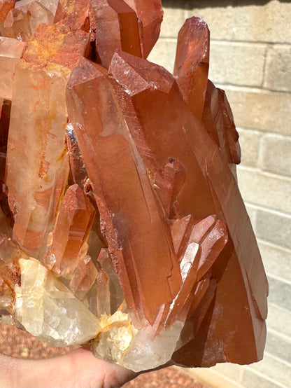 Detail of well-formed quartz points on one end of the piece, with smaller points jutting out of the base.