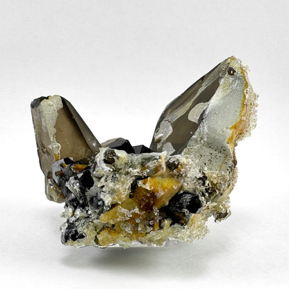 Smoky quartz and black tourmaline cluster with hyalite