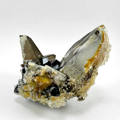 Smoky quartz and black tourmaline cluster with hyalite