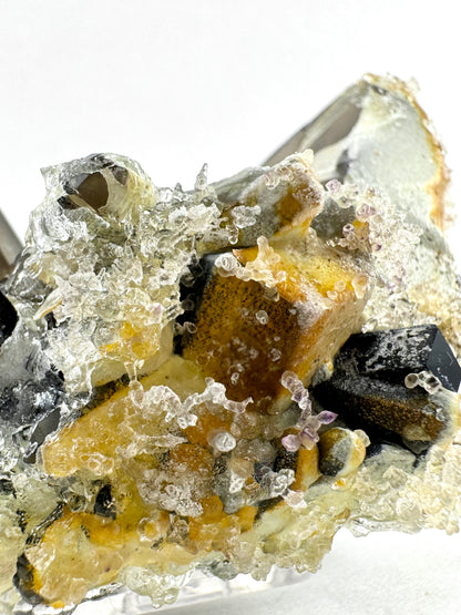 Smoky quartz and black tourmaline cluster with hyalite