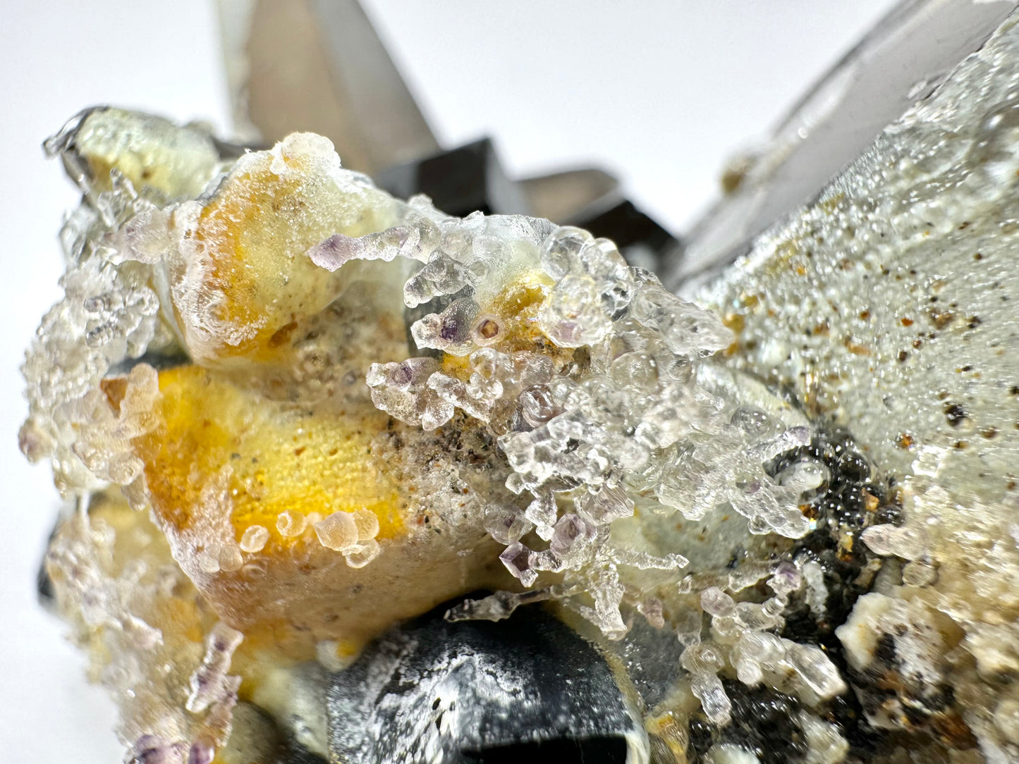 Smoky quartz and black tourmaline cluster with hyalite