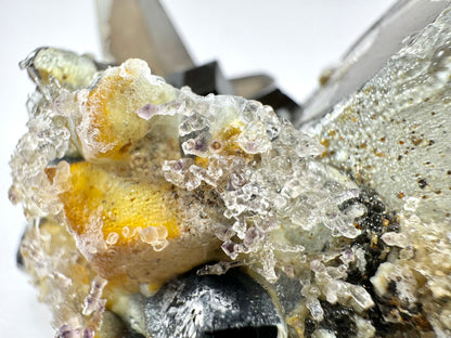 Smoky quartz and black tourmaline cluster with hyalite