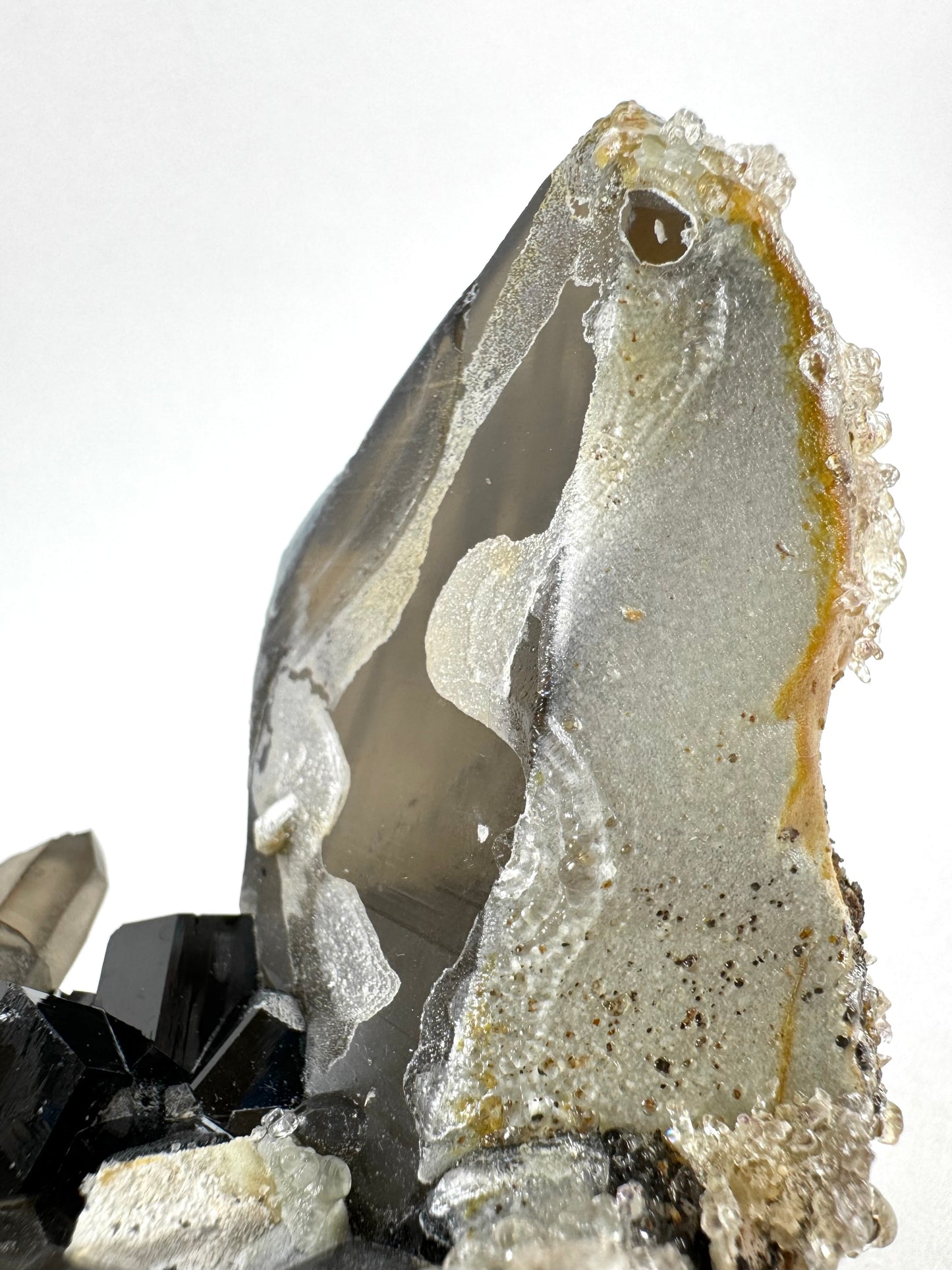 Smoky quartz and black tourmaline cluster with hyalite