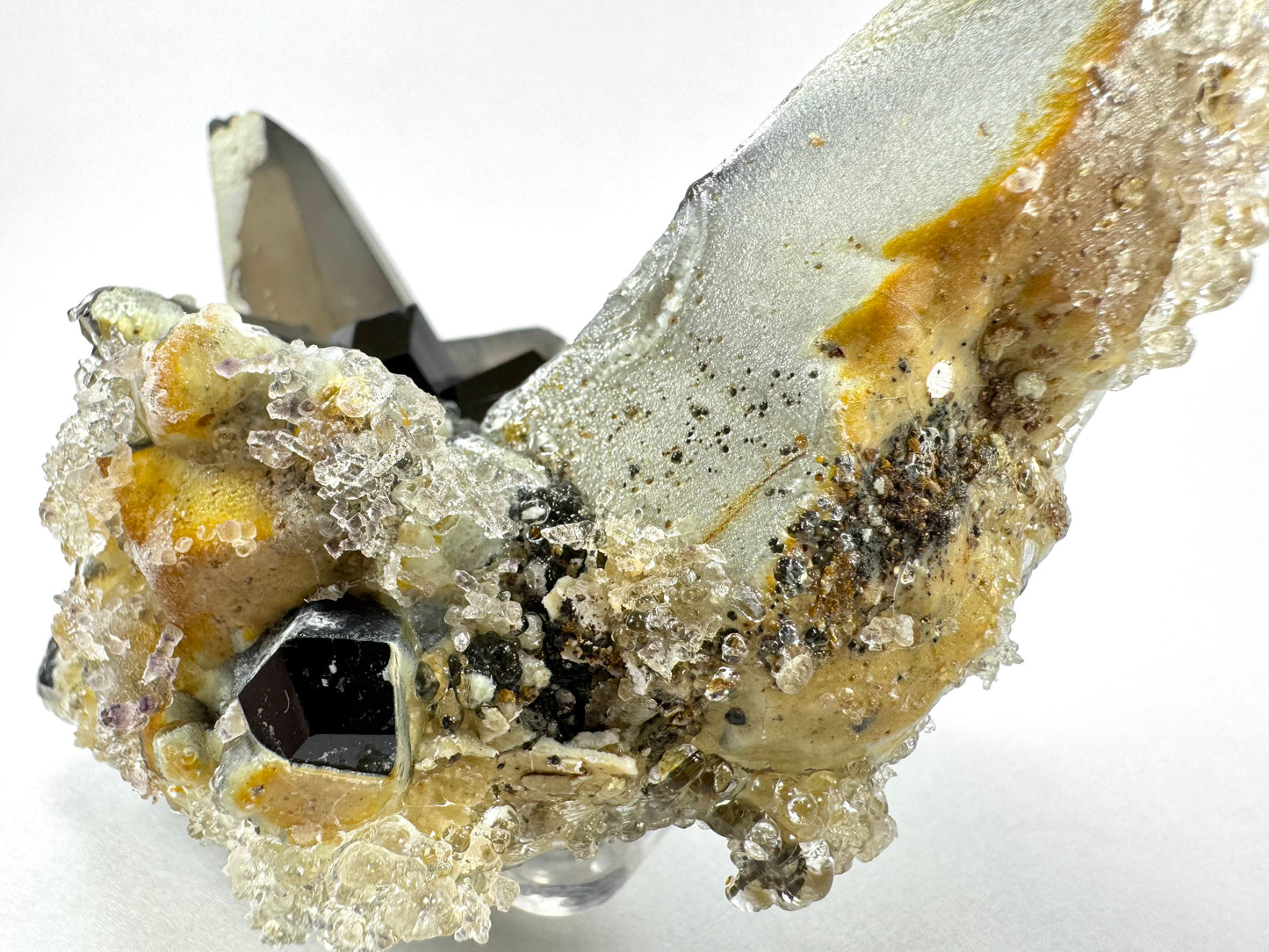 Smoky quartz and black tourmaline cluster with hyalite