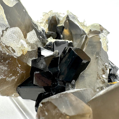 Smoky quartz and black tourmaline cluster with hyalite