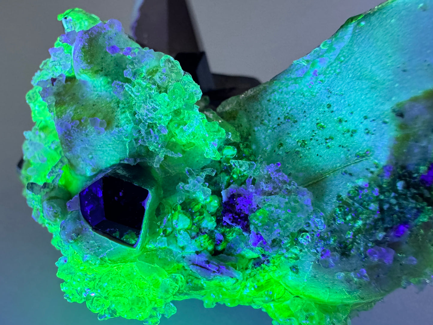 Smoky quartz and black tourmaline cluster with hyalite