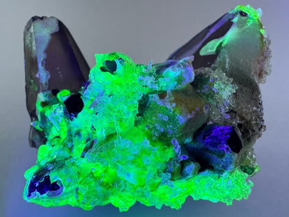 Smoky quartz and black tourmaline cluster with hyalite