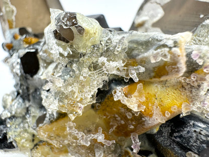 Smoky quartz and black tourmaline cluster with hyalite