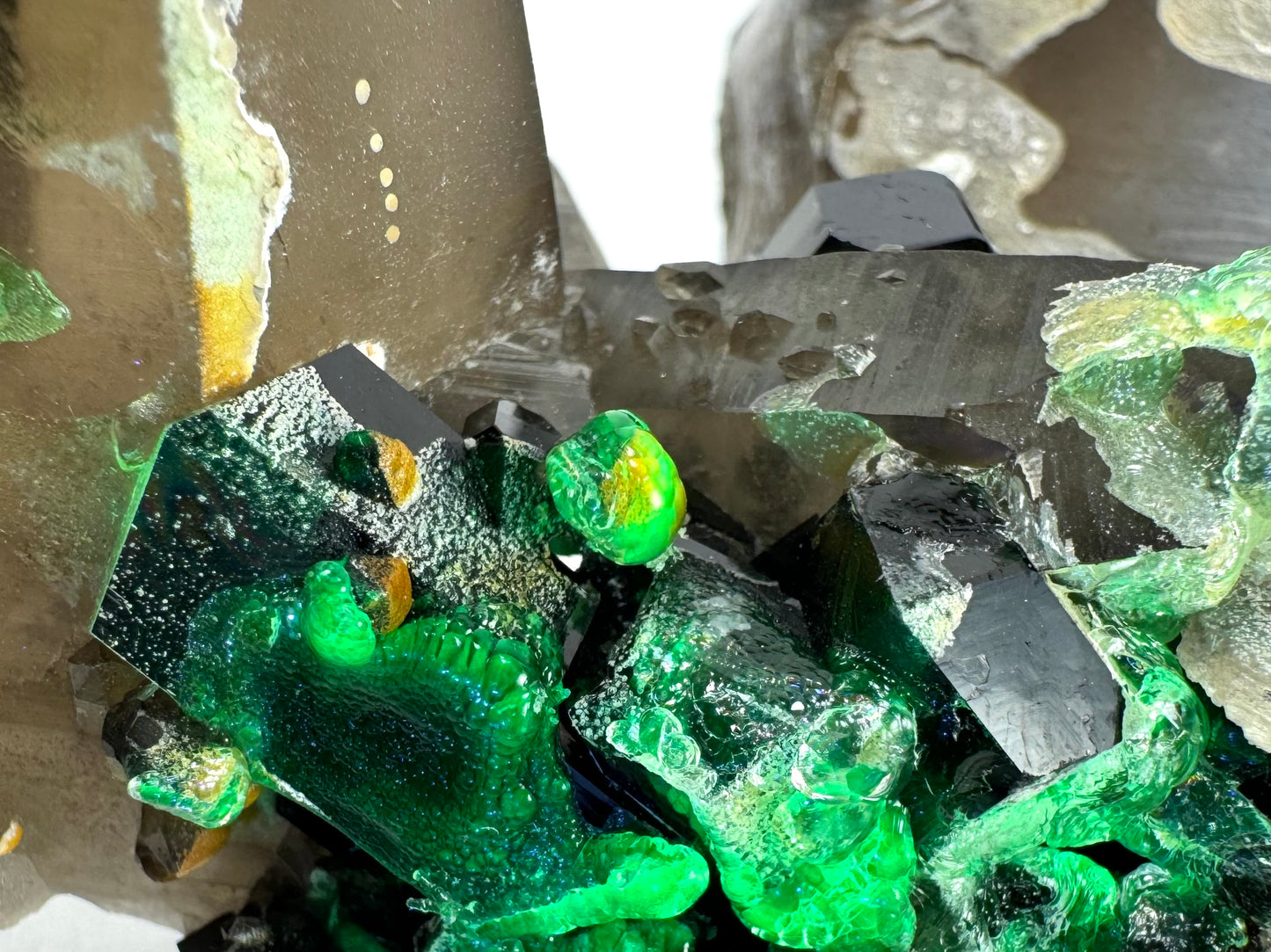 Smoky quartz and black tourmaline cluster with hyalite