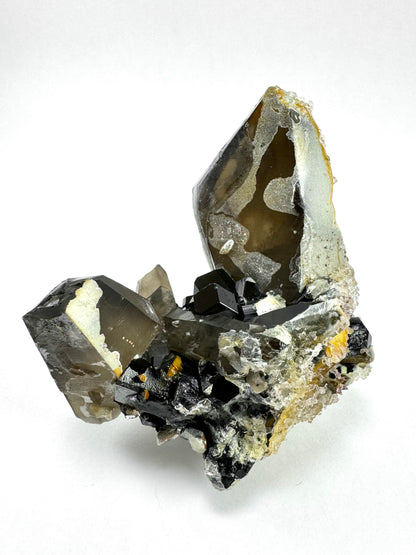 Smoky quartz and black tourmaline cluster with hyalite