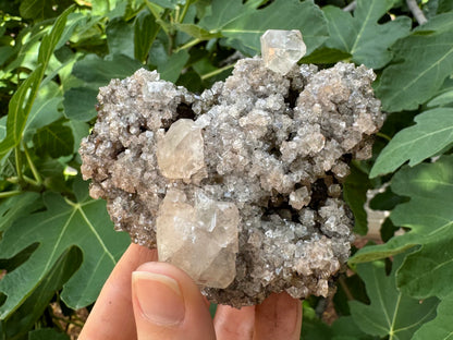 Angled view of the front, better showing the third calcite crystal attached at the top.