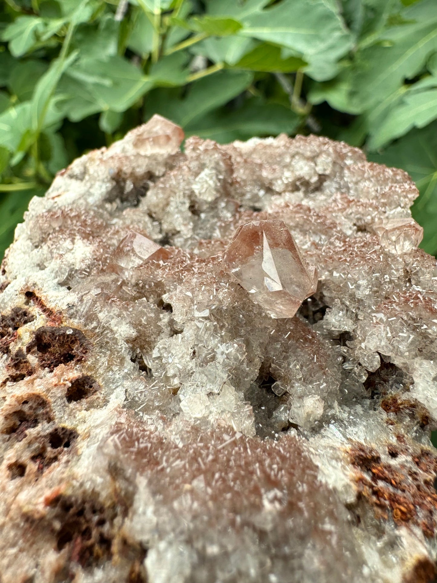 Colorless calcite with dusting of red-brown iron