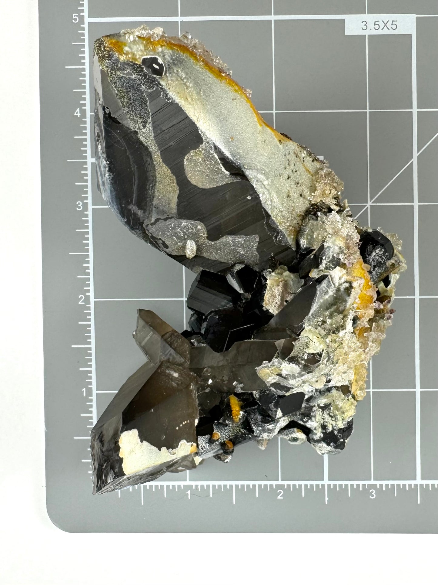 Smoky quartz and black tourmaline cluster with hyalite