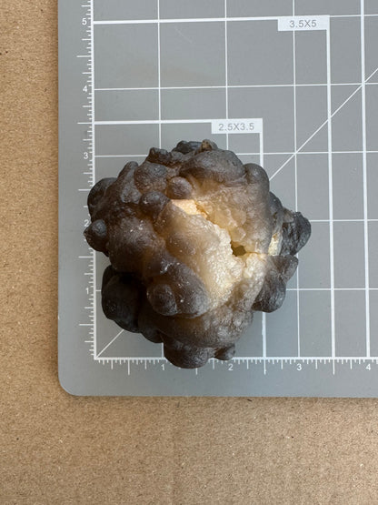 Chalcedony nodule on measuring mat, showing it's a bit over 2 inches square