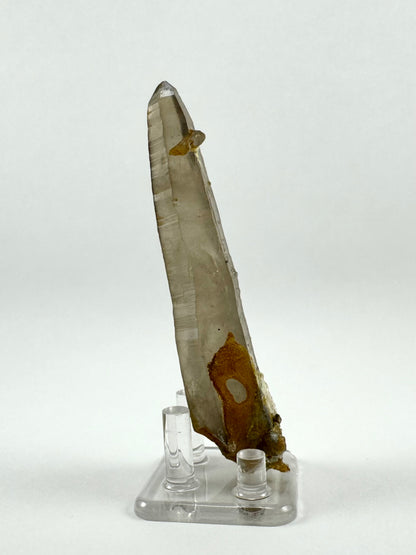 View of another side of the piece, emphasizing well-formed horizontal striations down the length of the quartz point faces.