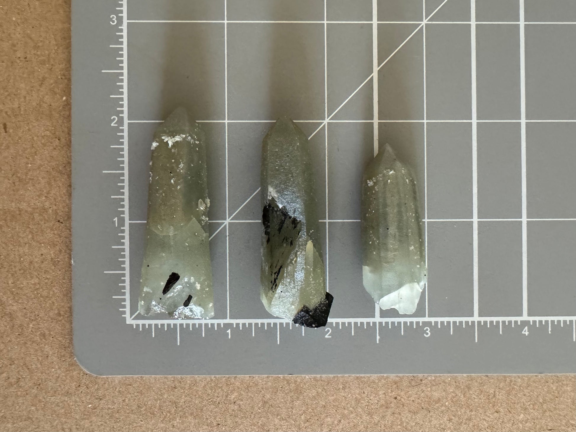 Scale image showing the three points line up on a measuring mat. Options A and B are a bit over two inches long, and option C is a bit over an inch and a half.