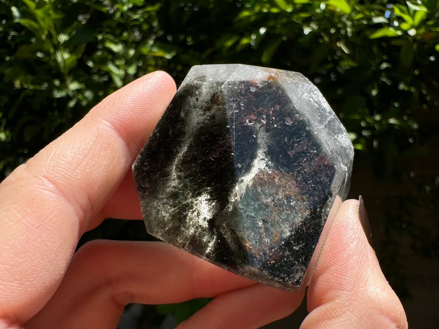 Dark mossy inclusions of chlorite with some lighter streaky green