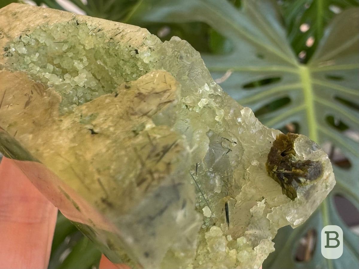 Detail of the base showing a partial radial epidote crystal in the open base of the tower.