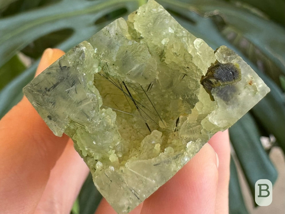 Option B, detail of the base showing it is largely hollow, with fine epidote needles intersecting the hollow.