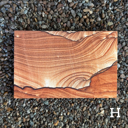 Option H, a standard rectangle with very good pattern, darker red-brown thin layers curve across the piece, with a bold dark iron band running across the bottom, like a landscape with broad sky over it. Below the line is a deeper red-orange color, and above is near white in a gradient deepening to darker brown-red. There is some scallop pattern in the upper right.