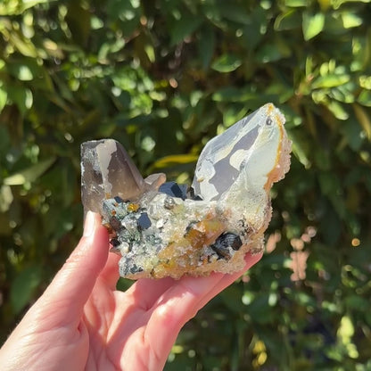 Smoky quartz and black tourmaline cluster with hyalite