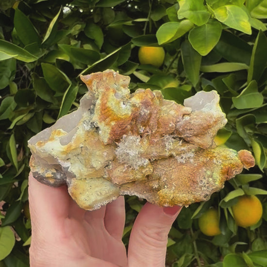 Short clip of the underside of the specimen, zooming in to show detail of the thick hyalite, and the structure made of small needles.