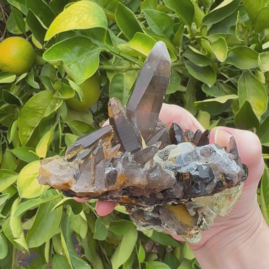 Short clip of the specimen being turned and tilted, zooming in on details. The top has nice angular quartz points, and the hyalite on the underside has excellent daylight fluorescence, glowing a light yellow-green.