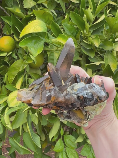 Short clip of the specimen being turned and tilted, zooming in on details. The top has nice angular quartz points, and the hyalite on the underside has excellent daylight fluorescence, glowing a light yellow-green.