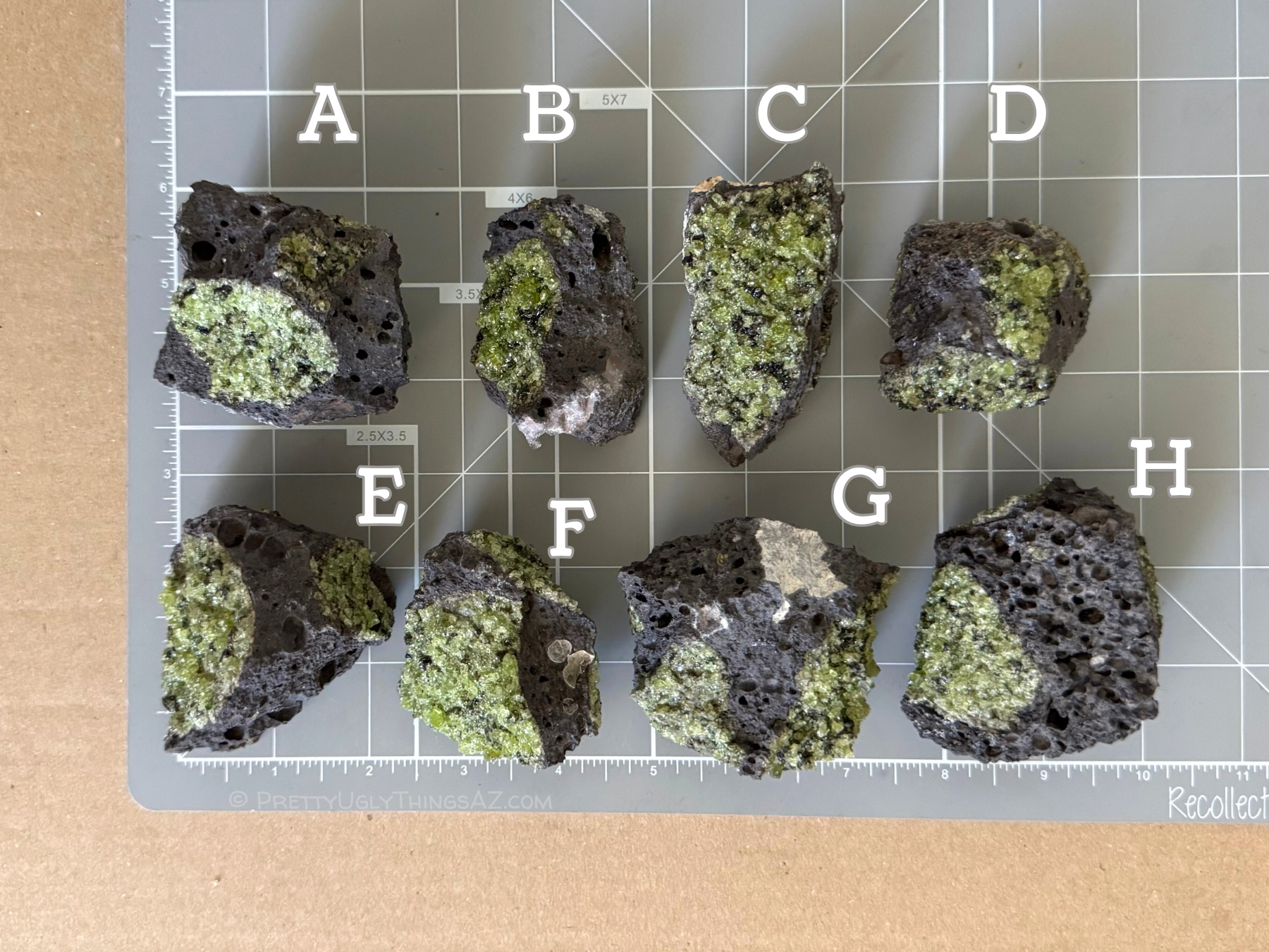 Options A through H in two rows on a measuring mat, each measuring around two to two and three-quarters inches. Options A, G, and H are the largest, and option D is the smallest.