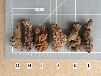 Scale image of options G through L on a measuring mat. G,H, K, and L are all almost two and a half inches long. I and J are two inches.